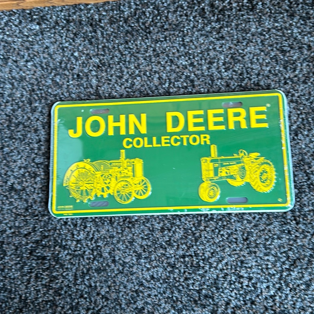 John Deere Collector License Plate. Still in plastic. Have three.
